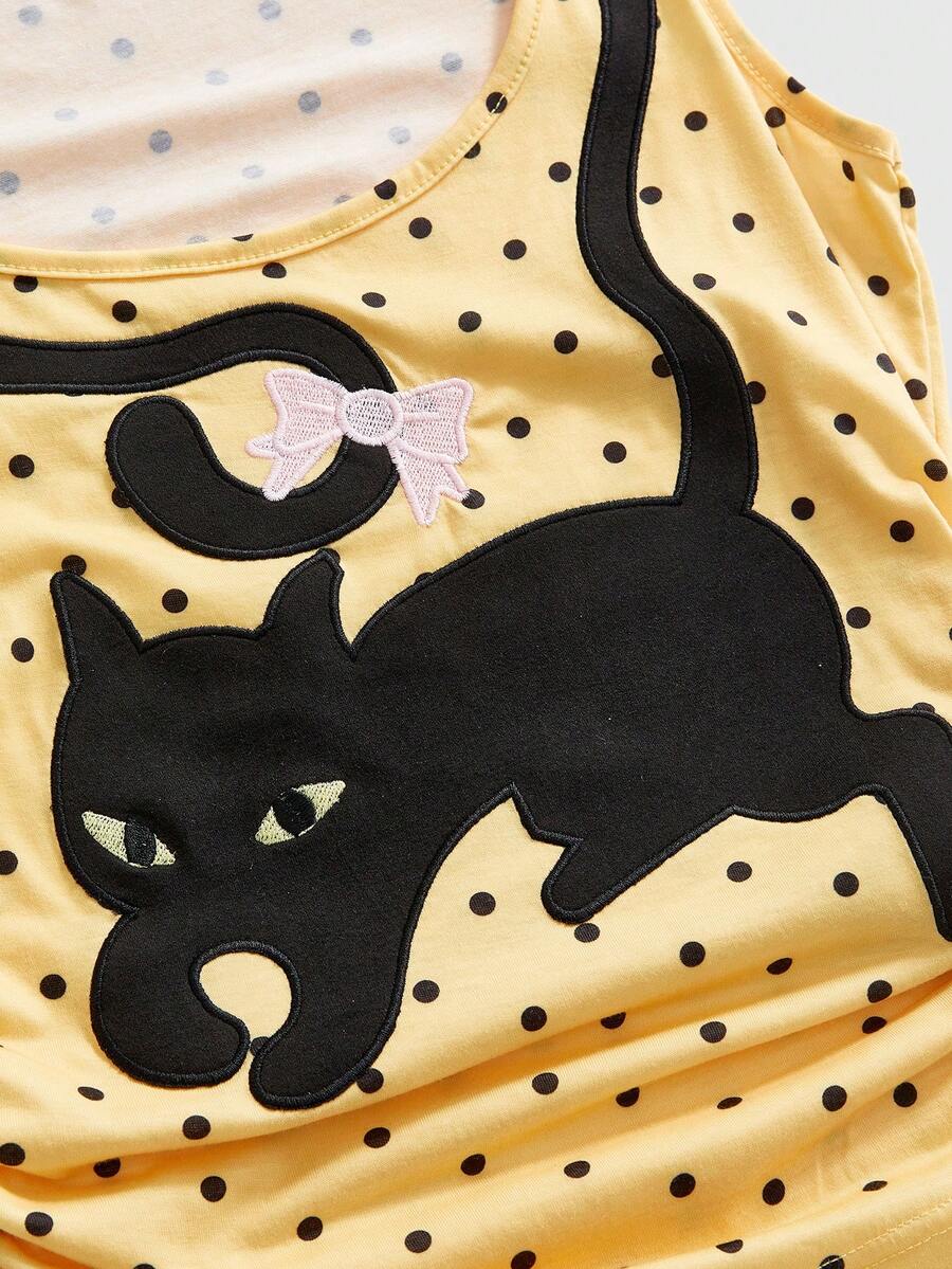 White slim fit square neck polka dot camisole top featuring cat and butterfly graphic print with studded arm sleeves.