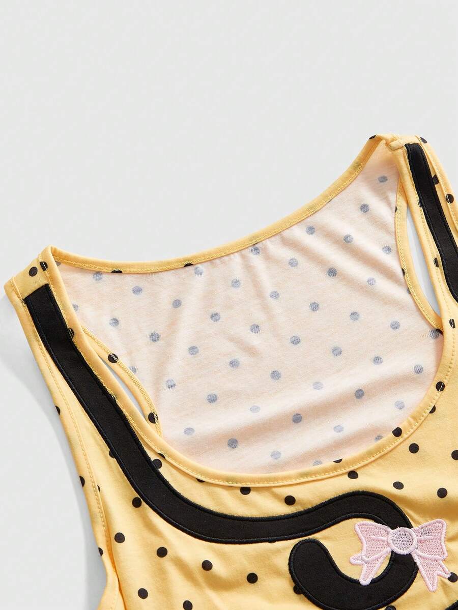 White slim fit square neck polka dot camisole top featuring cat and butterfly graphic print with studded arm sleeves.