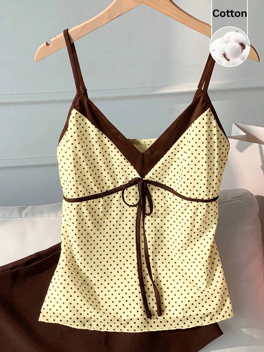 Black and white polka dot tie strap camisole top for women with thin spaghetti straps and slim fit.