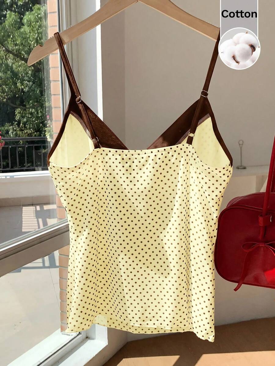 Black and white polka dot tie strap camisole top for women with thin spaghetti straps and slim fit.