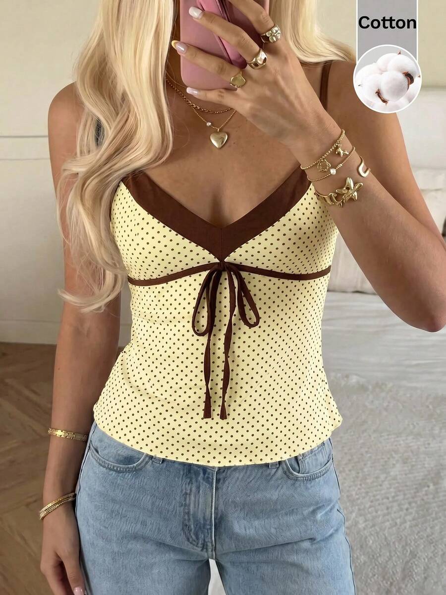 Black and white polka dot tie strap camisole top for women with thin spaghetti straps and slim fit.