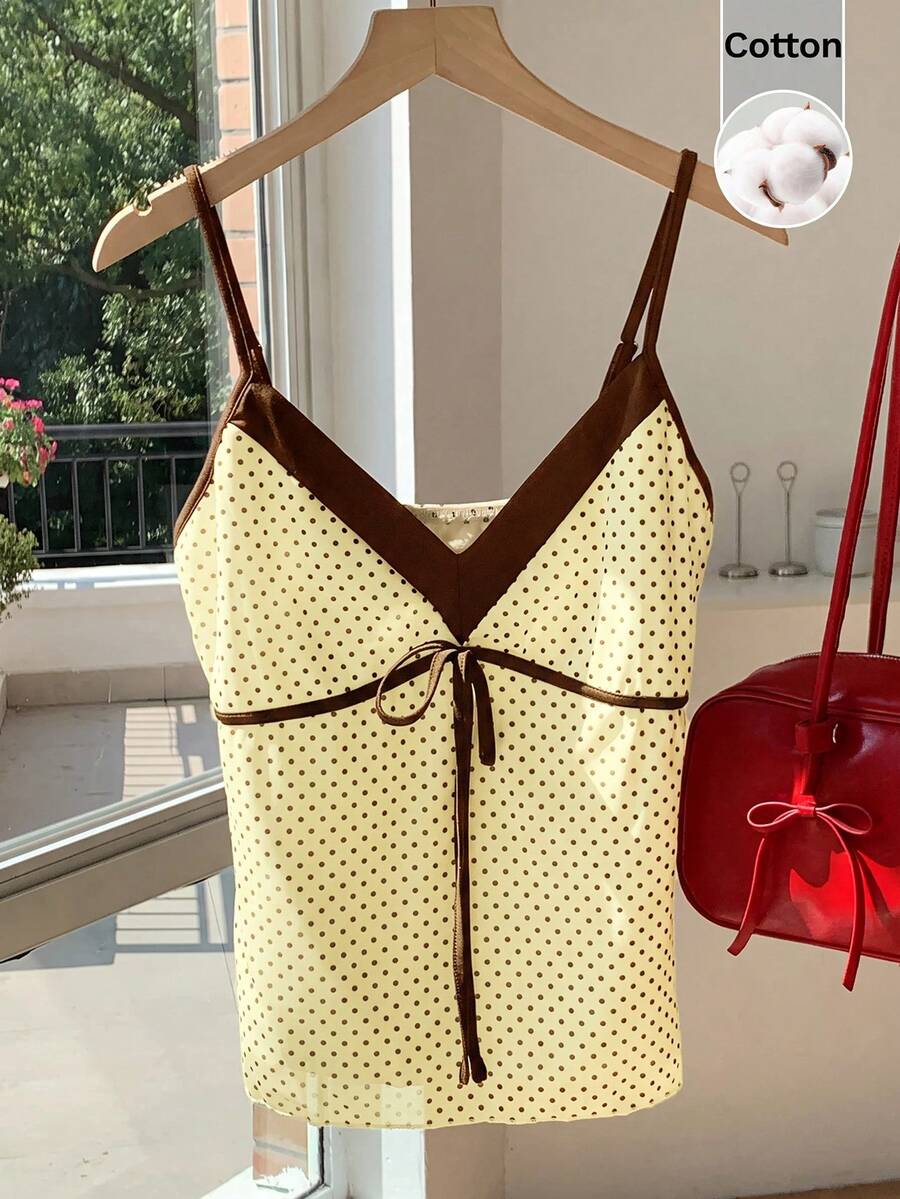 Black and white polka dot tie strap camisole top for women with thin spaghetti straps and slim fit.