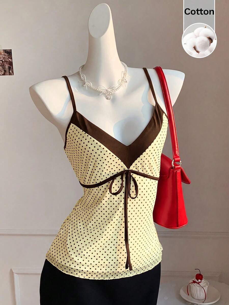 Black and white polka dot tie strap camisole top for women with thin spaghetti straps and slim fit.