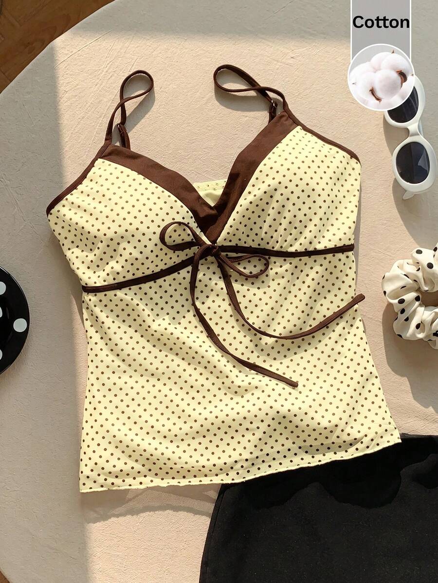 Black and white polka dot tie strap camisole top for women with thin spaghetti straps and slim fit.