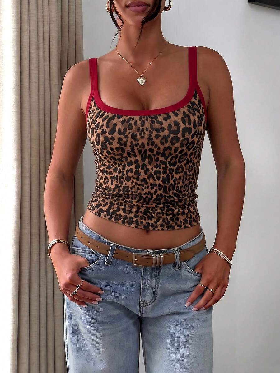 A slim fit women's crop cami tank top with spaghetti straps and a solid color design, made from comfortable stretch knitted fabric.