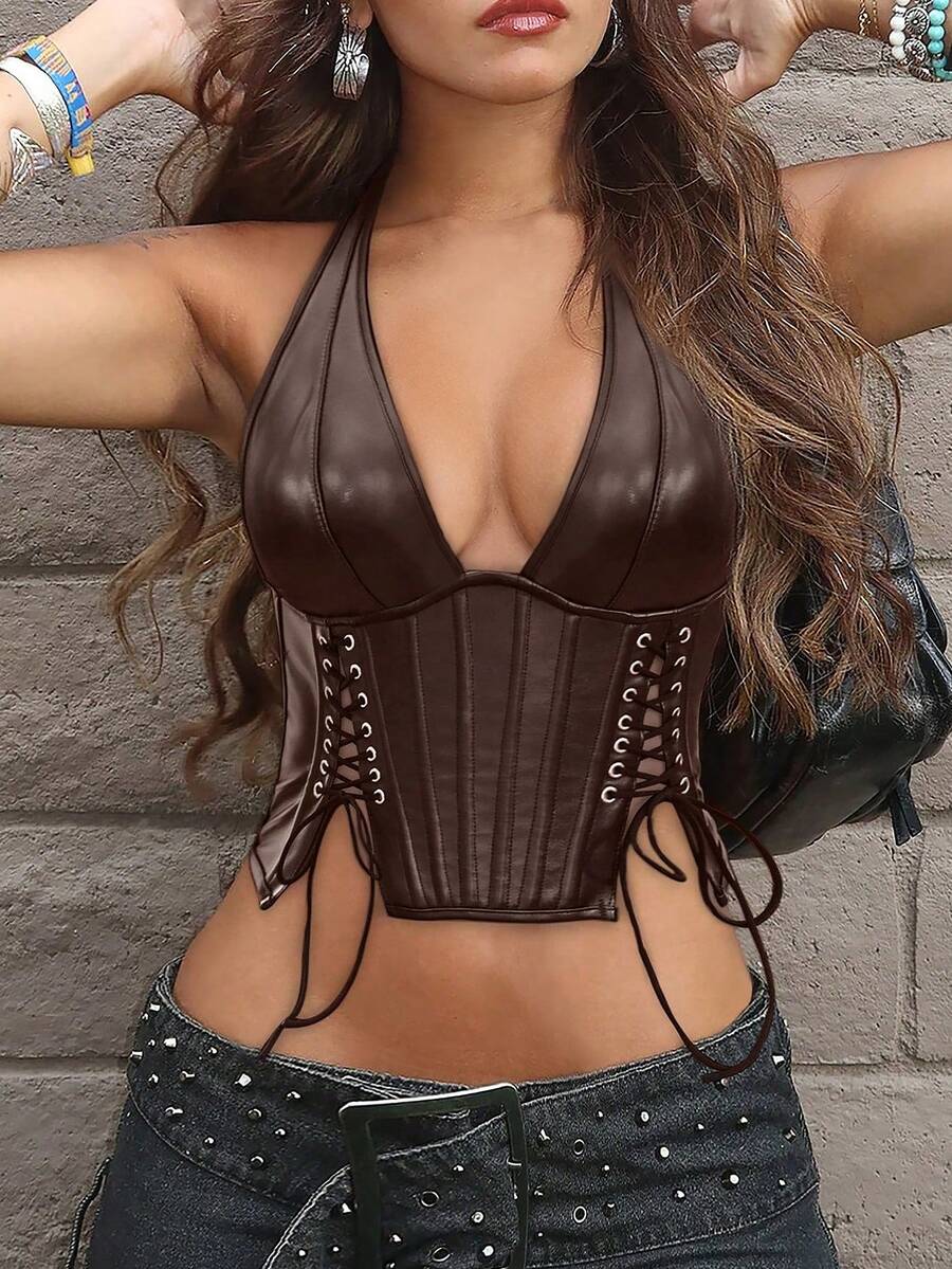 Black PU leather halter crop top for women with a backless design, split detail, tie-back closure, and grommet eyelets.