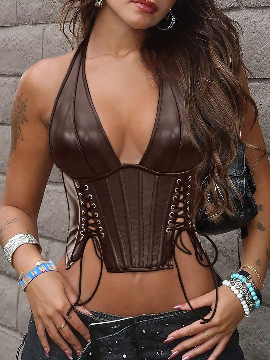 Black PU leather halter crop top for women with a backless design, split detail, tie-back closure, and grommet eyelets.
