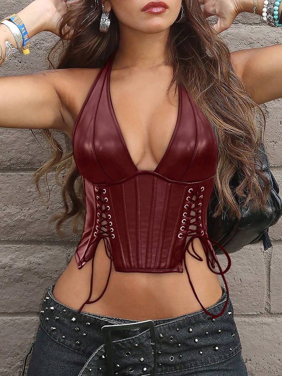 Black PU leather halter crop top for women with a backless design, split detail, tie-back closure, and grommet eyelets.