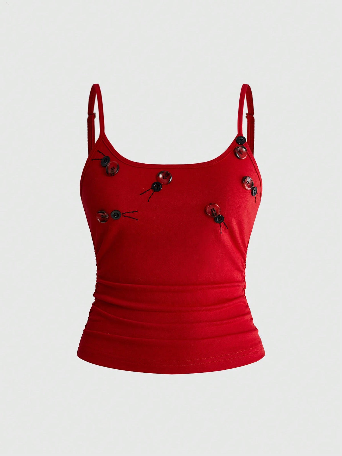 Woman wearing a black backless halter tank top with criss-cross details and textured knit fabric