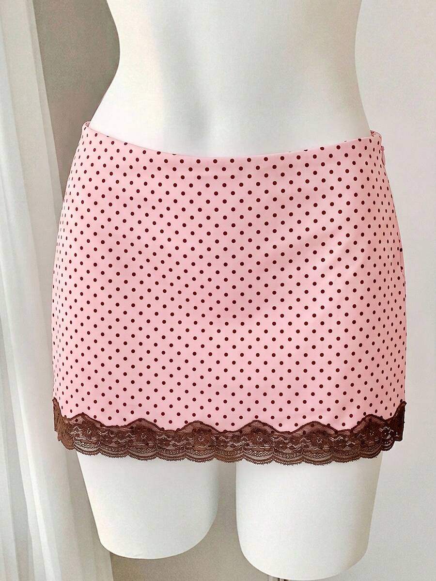 Women's white 100% cotton low waist mini skirt featuring a tropical print and zipper detail.