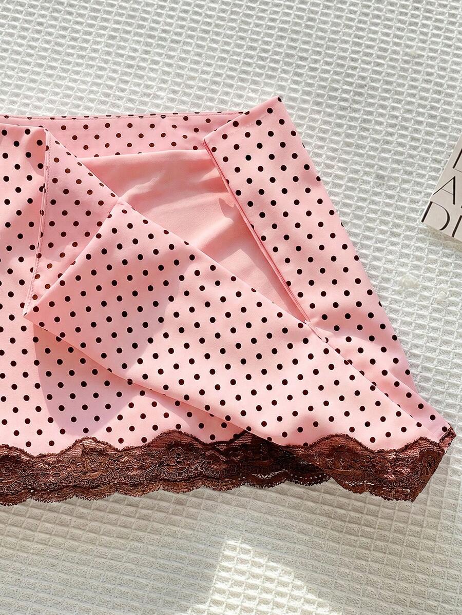 Women's white 100% cotton low waist mini skirt featuring a tropical print and zipper detail.