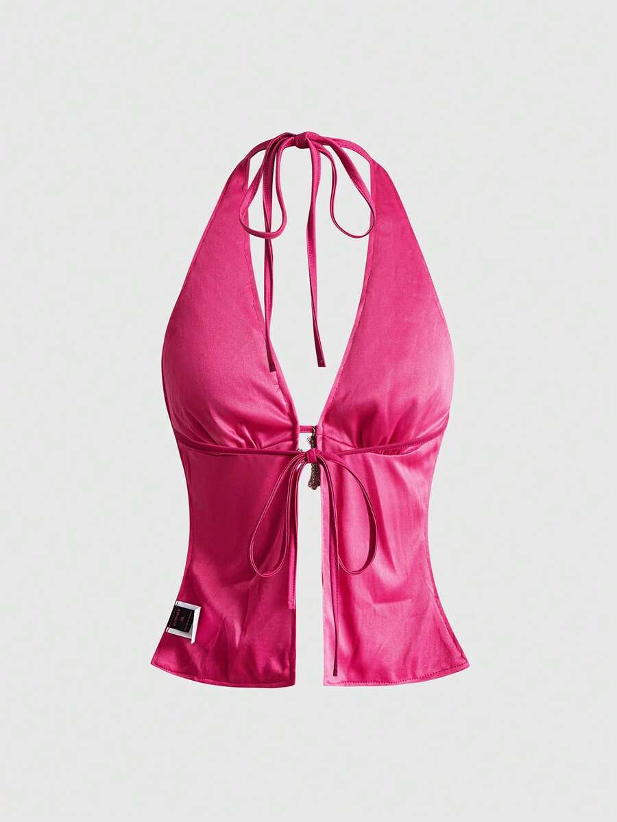 Women's sequin halter tank top featuring a backless slim fit design with knot and split details.