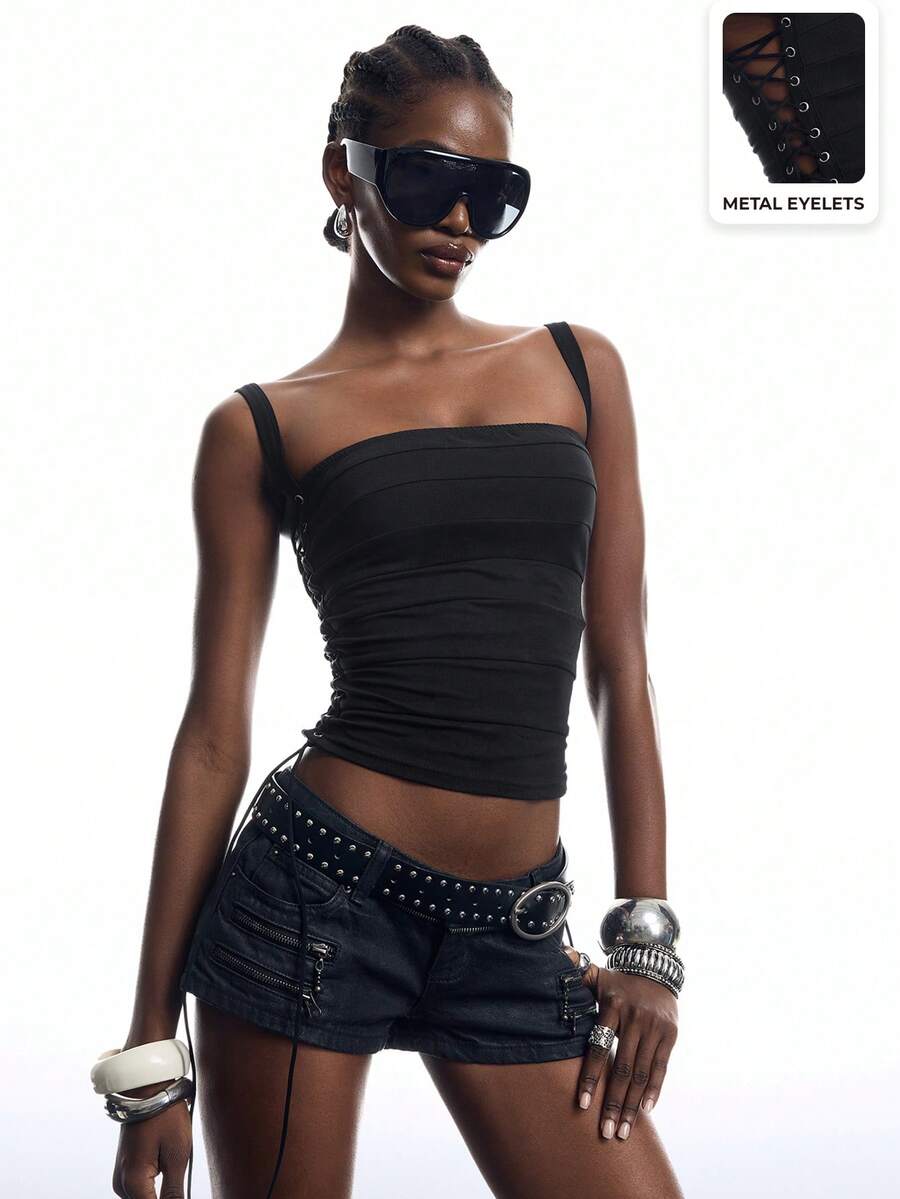 Black PU leather cropped camisole top for women featuring spaghetti straps, side tie details, and a ruched slim fit.