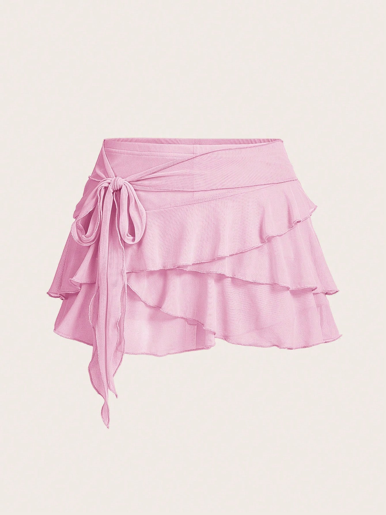 White tiered ruffle trim mini skirt for women with low waist, knot detail, mesh fabric, and casual Y2K boho design.