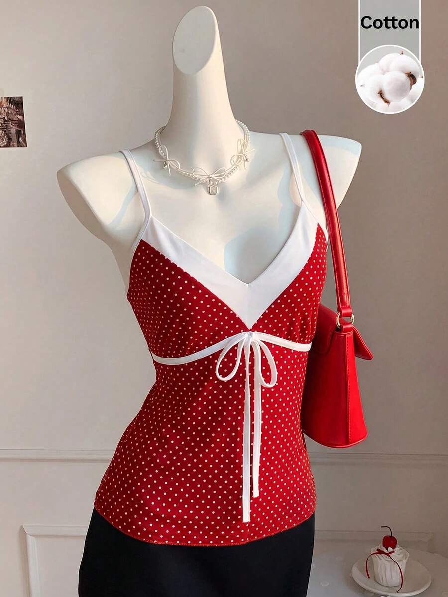 Black and white polka dot tie strap camisole top for women with thin spaghetti straps and slim fit.