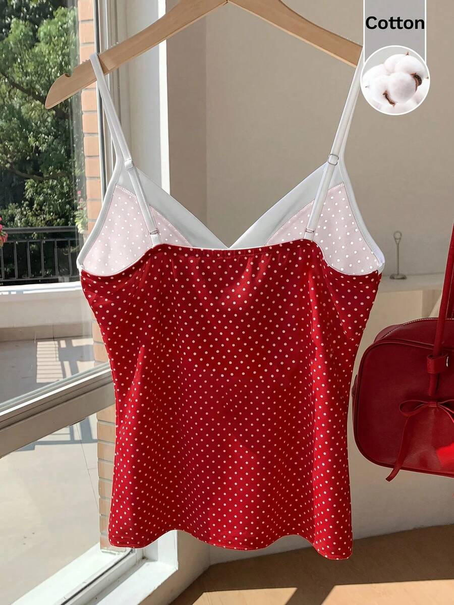 Black and white polka dot tie strap camisole top for women with thin spaghetti straps and slim fit.