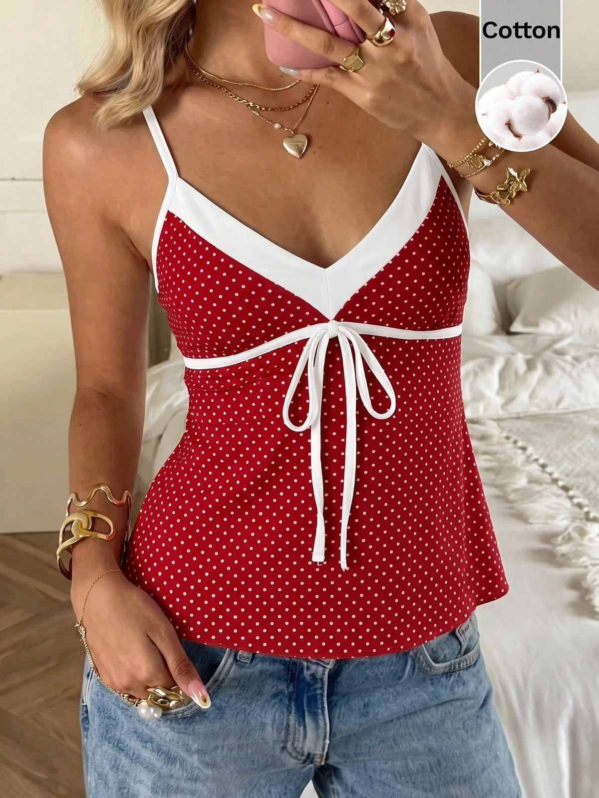 Black and white polka dot tie strap camisole top for women with thin spaghetti straps and slim fit.