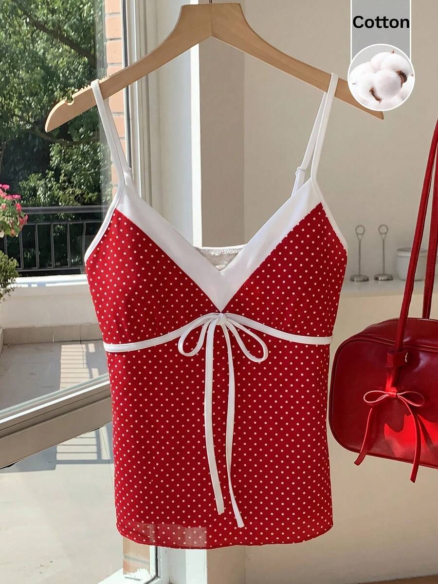 Black and white polka dot tie strap camisole top for women with thin spaghetti straps and slim fit.