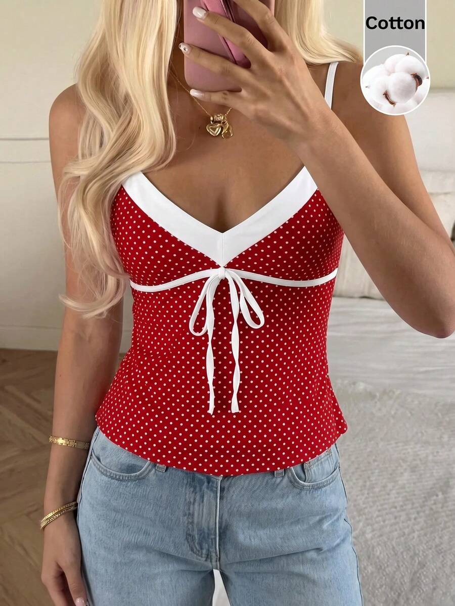 Black and white polka dot tie strap camisole top for women with thin spaghetti straps and slim fit.