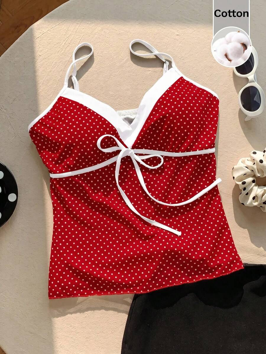 Black and white polka dot tie strap camisole top for women with thin spaghetti straps and slim fit.