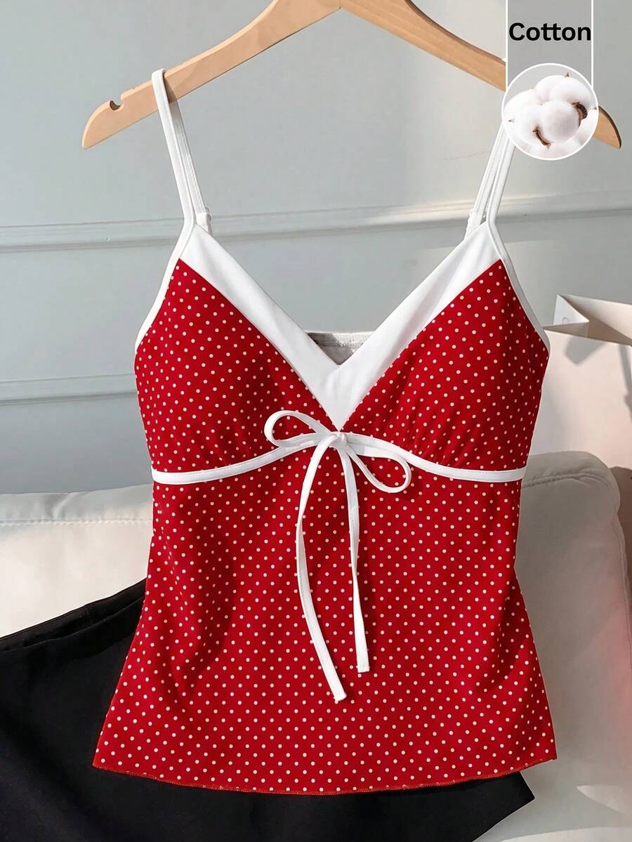 Black and white polka dot tie strap camisole top for women with thin spaghetti straps and slim fit.
