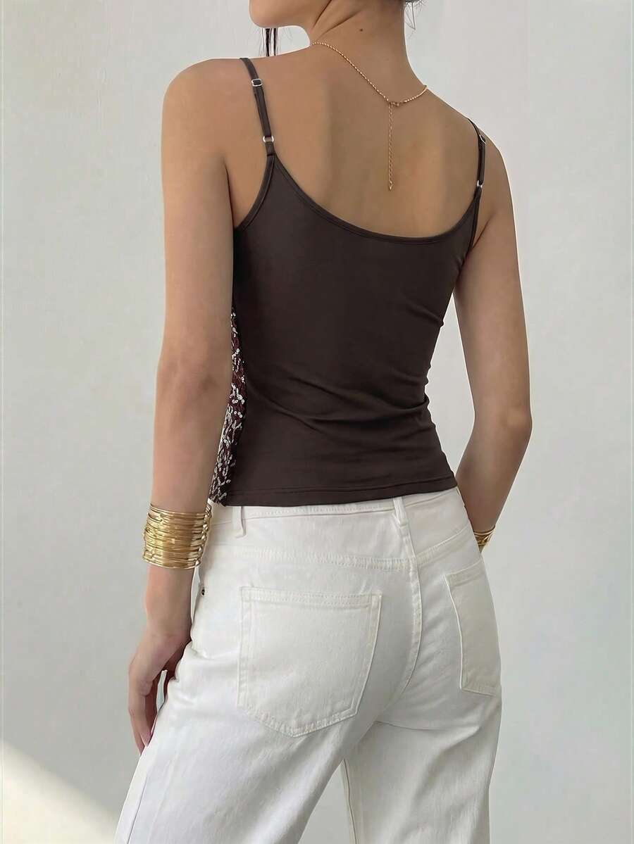 Women's sequin camisole top with spaghetti straps and a 3D rose embellishment