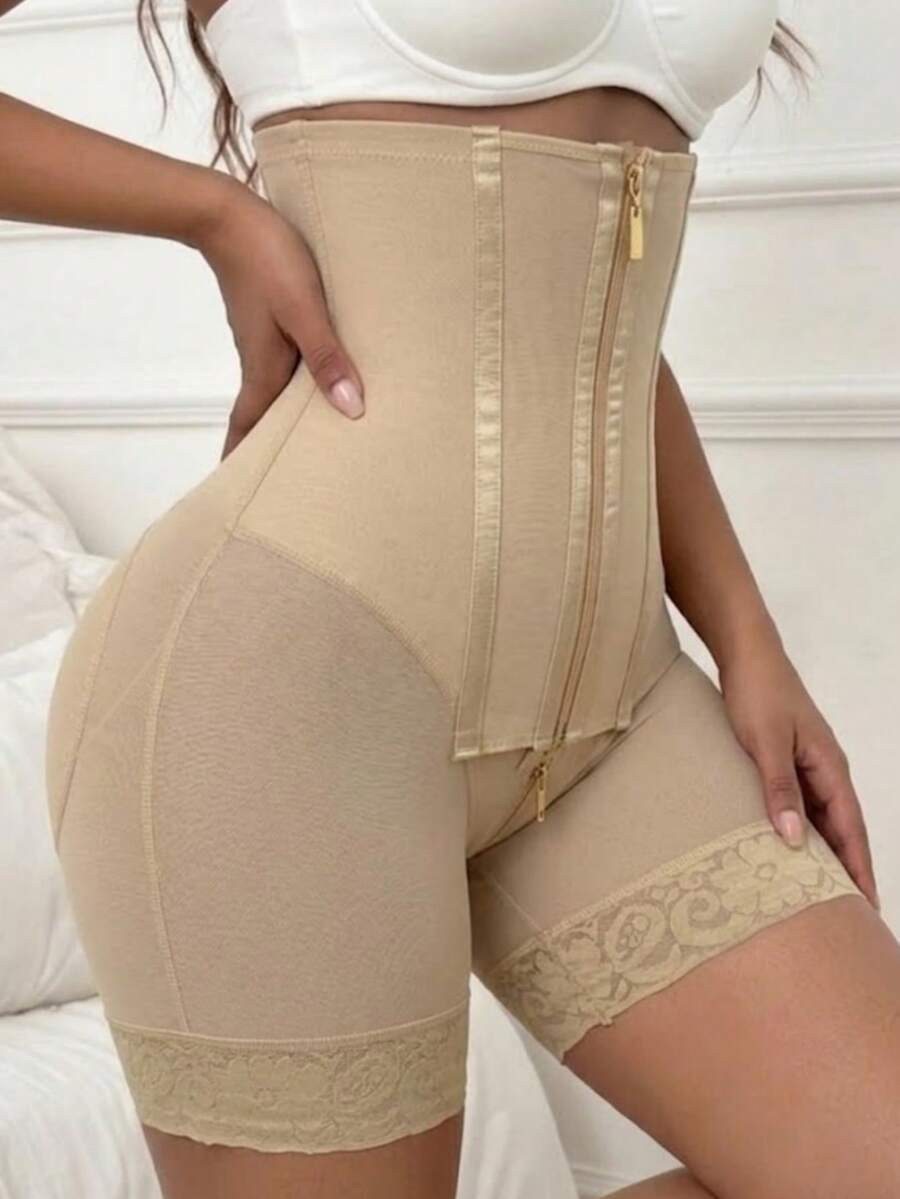 Women's high waist shaping shorts in apricot with zipper closure and tummy control features.