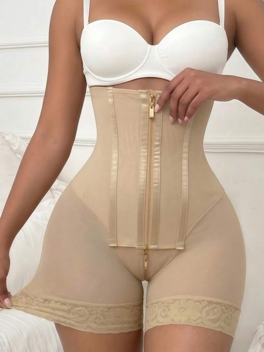 Women's high waist shaping shorts in apricot with zipper closure and tummy control features.