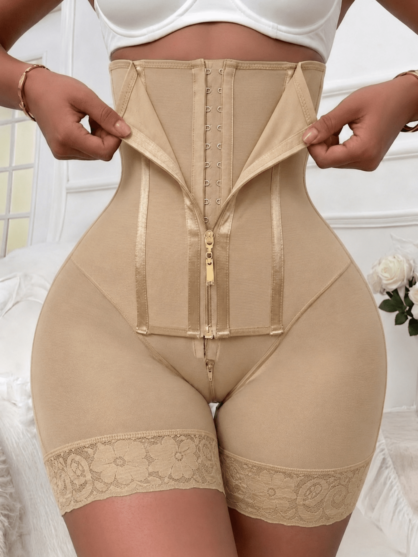 Women's high waist shaping shorts in apricot with zipper closure and tummy control features.
