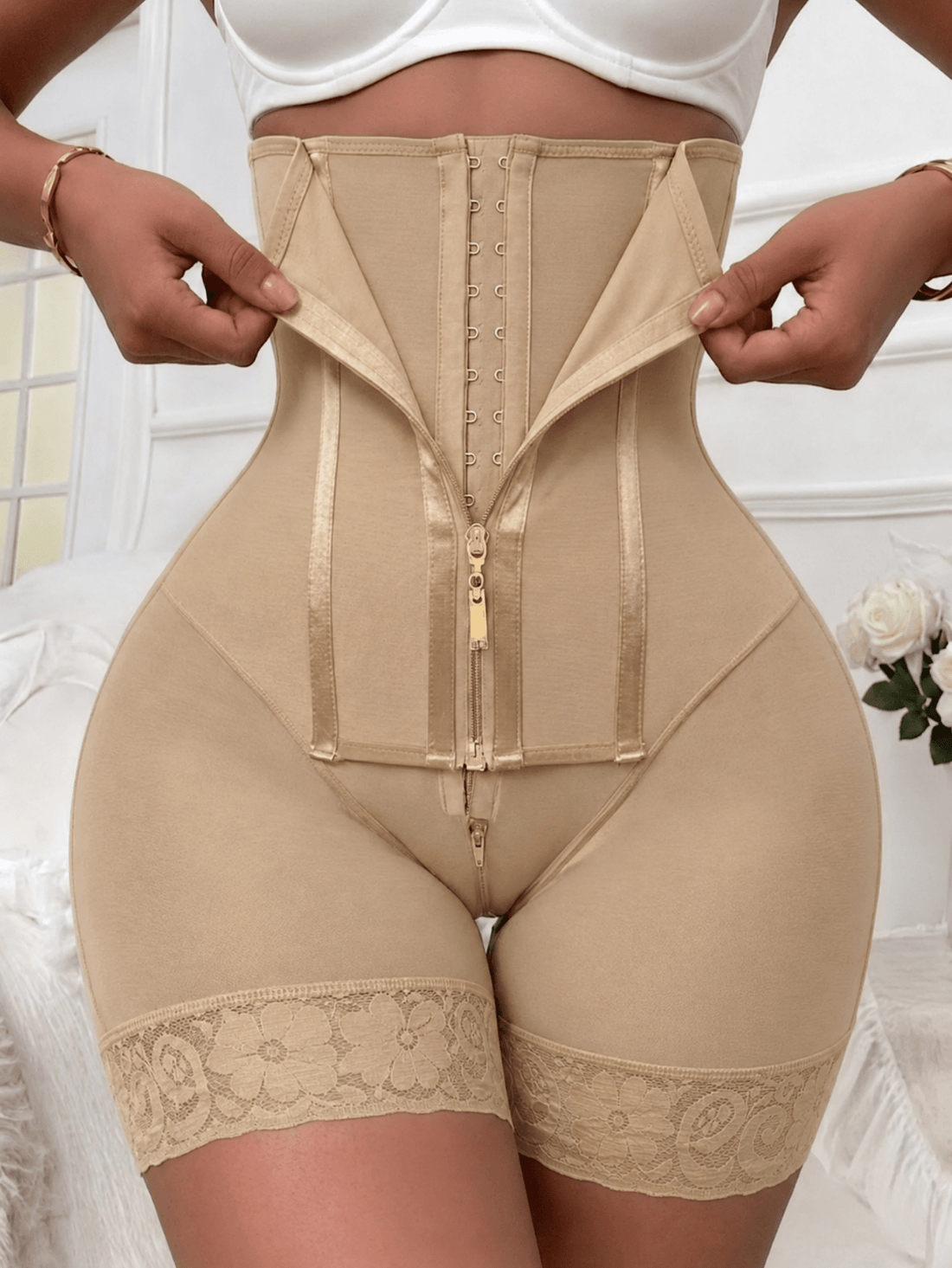 Women's high waist shaping shorts in apricot with zipper closure and tummy control features.