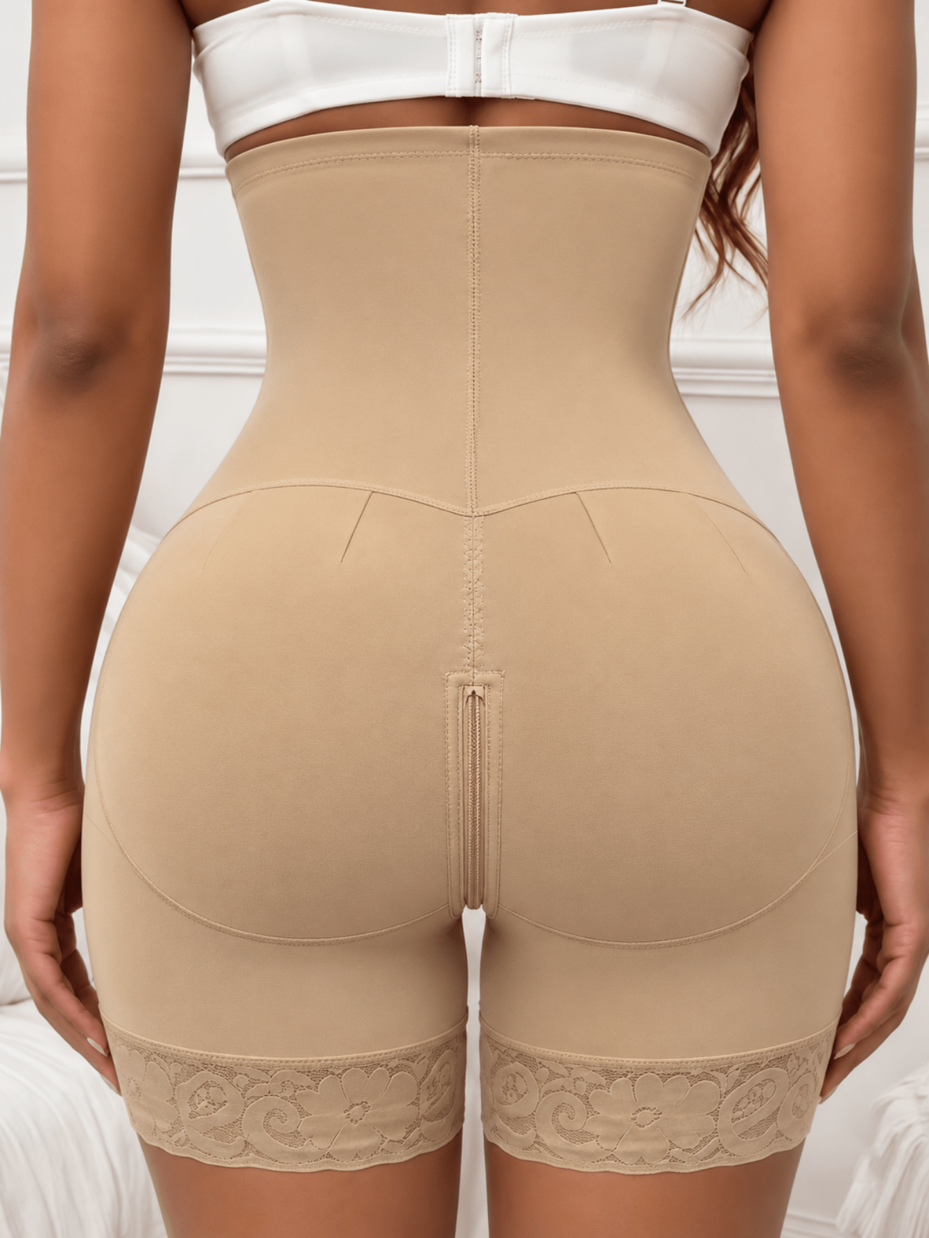 Women's high waist shaping shorts in apricot with zipper closure and tummy control features.