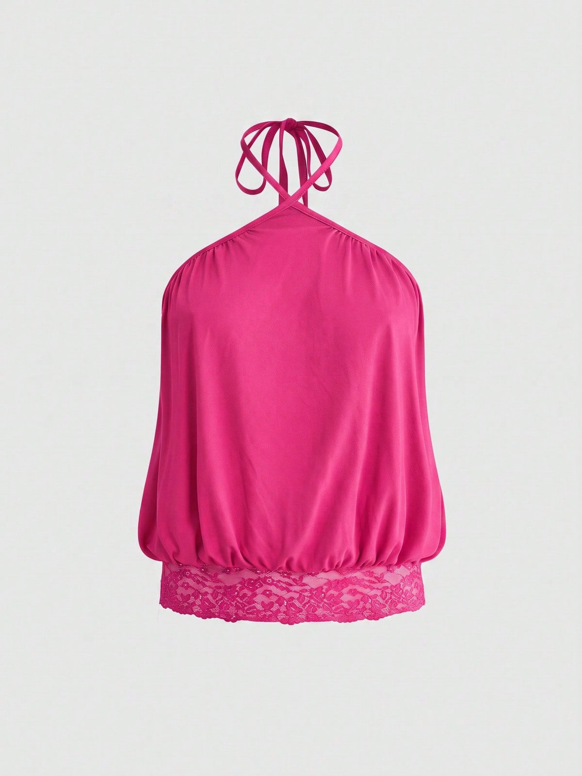 Woman wearing a black slim fit halter camisole crop top with lace-up backless tie detail.