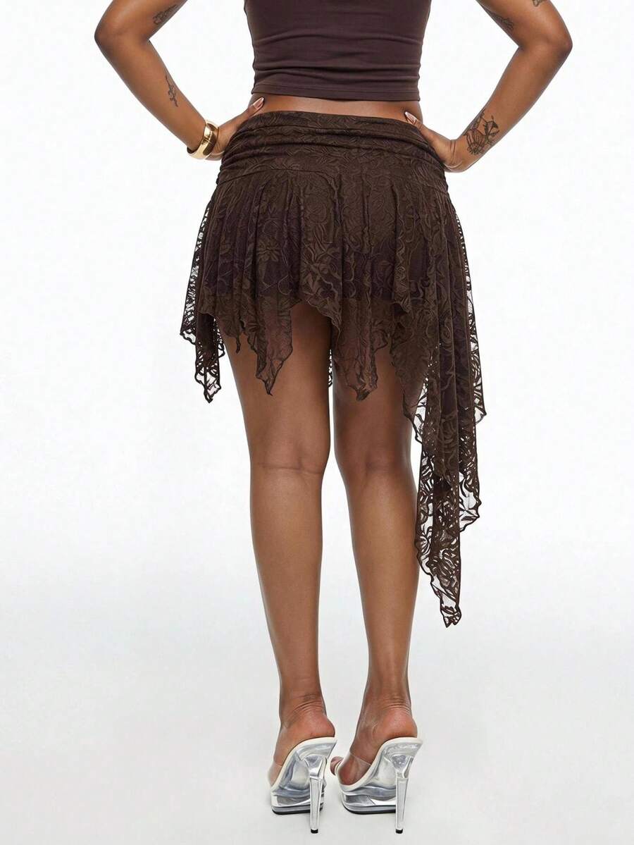 Women's asymmetrical ruffle skort with low waist, hollow out details, and lined body in knitted stretch fabric for beach and summer wear.