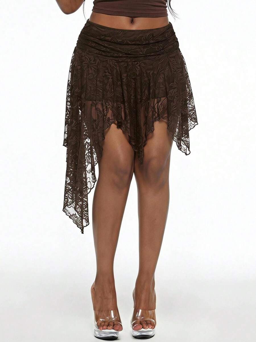 Women's asymmetrical ruffle skort with low waist, hollow out details, and lined body in knitted stretch fabric for beach and summer wear.