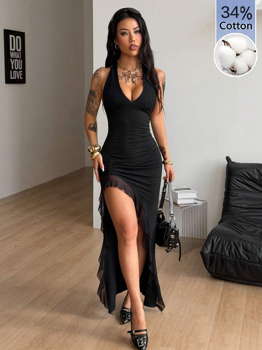 Women's black halter sleeveless bodycon maxi dress with a split thigh asymmetrical hem in knitted fabric.