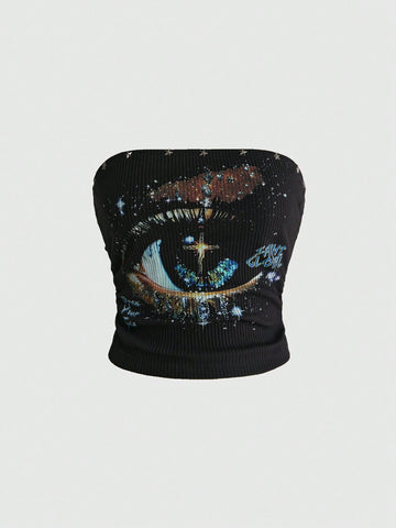 Black ribbed knit strapless crop tube top with an eye graphic print and star decor for women.