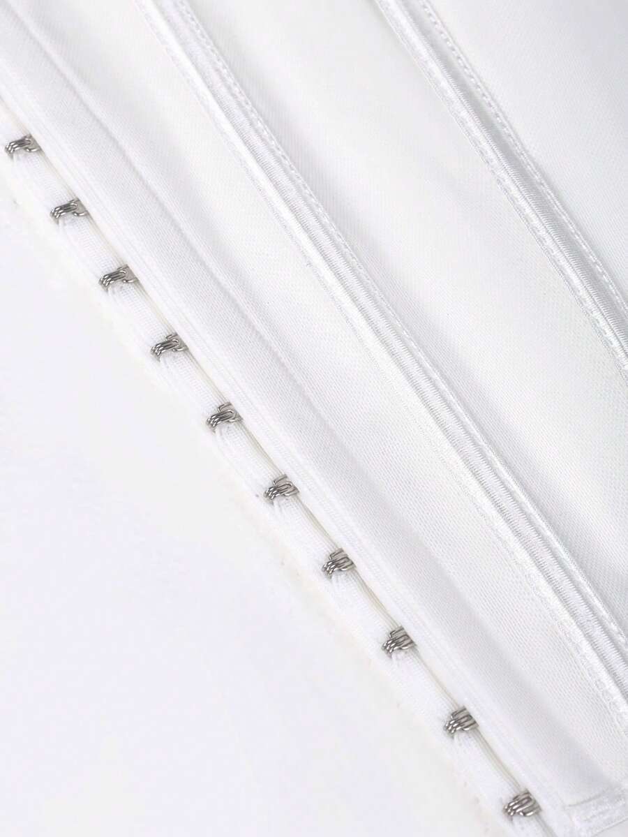 White Y2K halter backless corset top featuring lace-up back detail and metal grommet eyelets for women