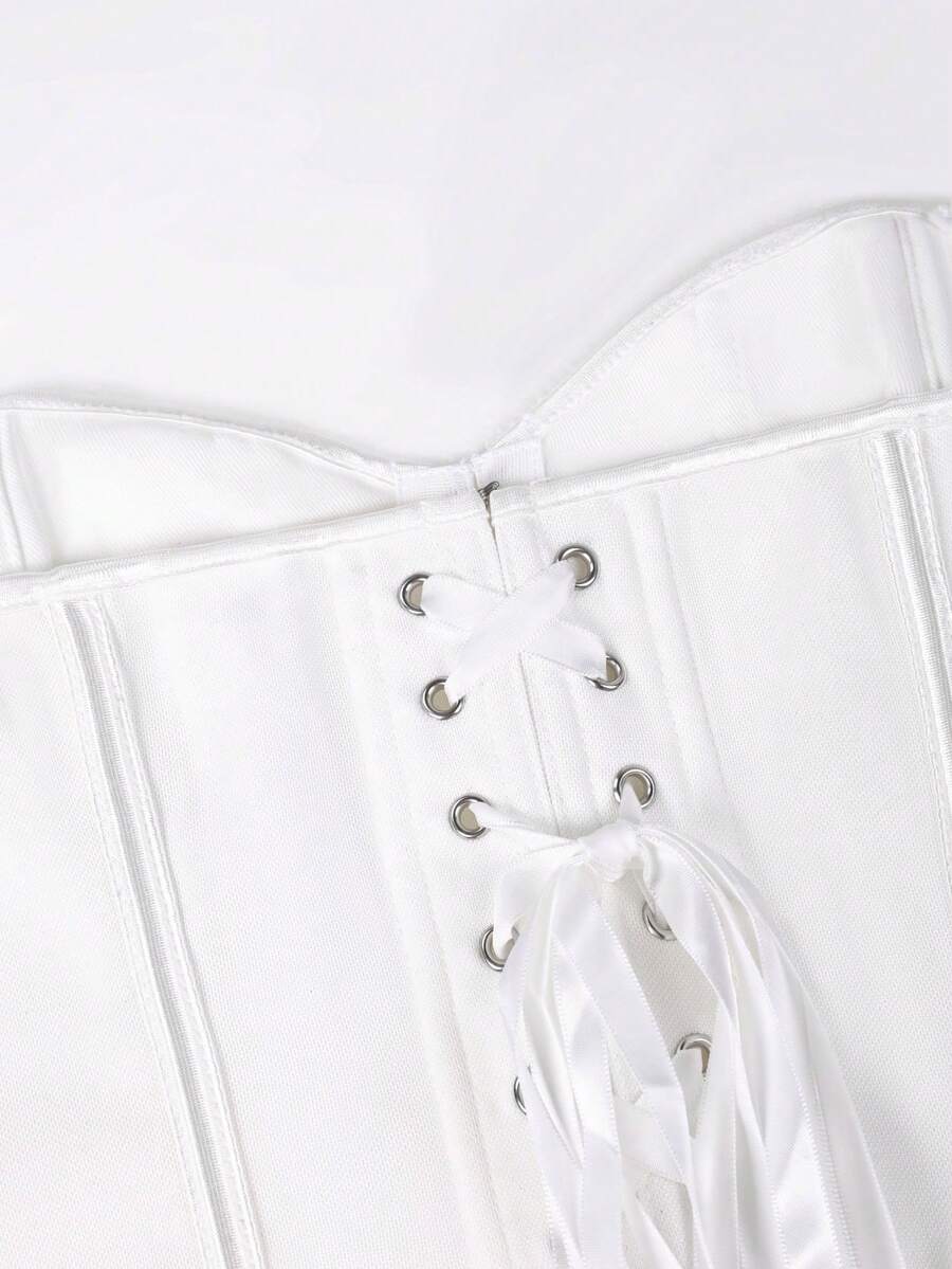 White Y2K halter backless corset top featuring lace-up back detail and metal grommet eyelets for women