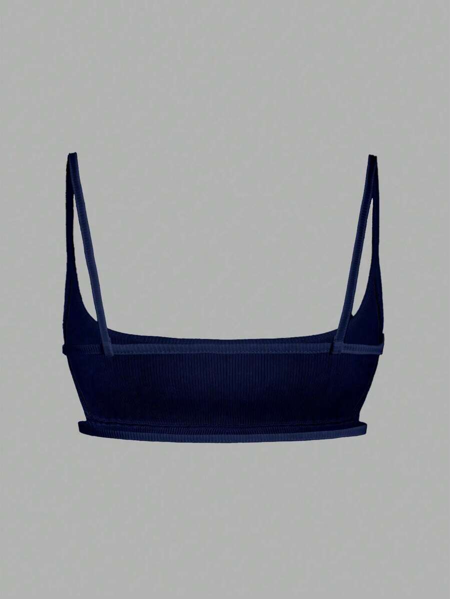 Women's black cropped camisole top with faux crocodile texture, backless spaghetti straps, and matching arm sleeves.