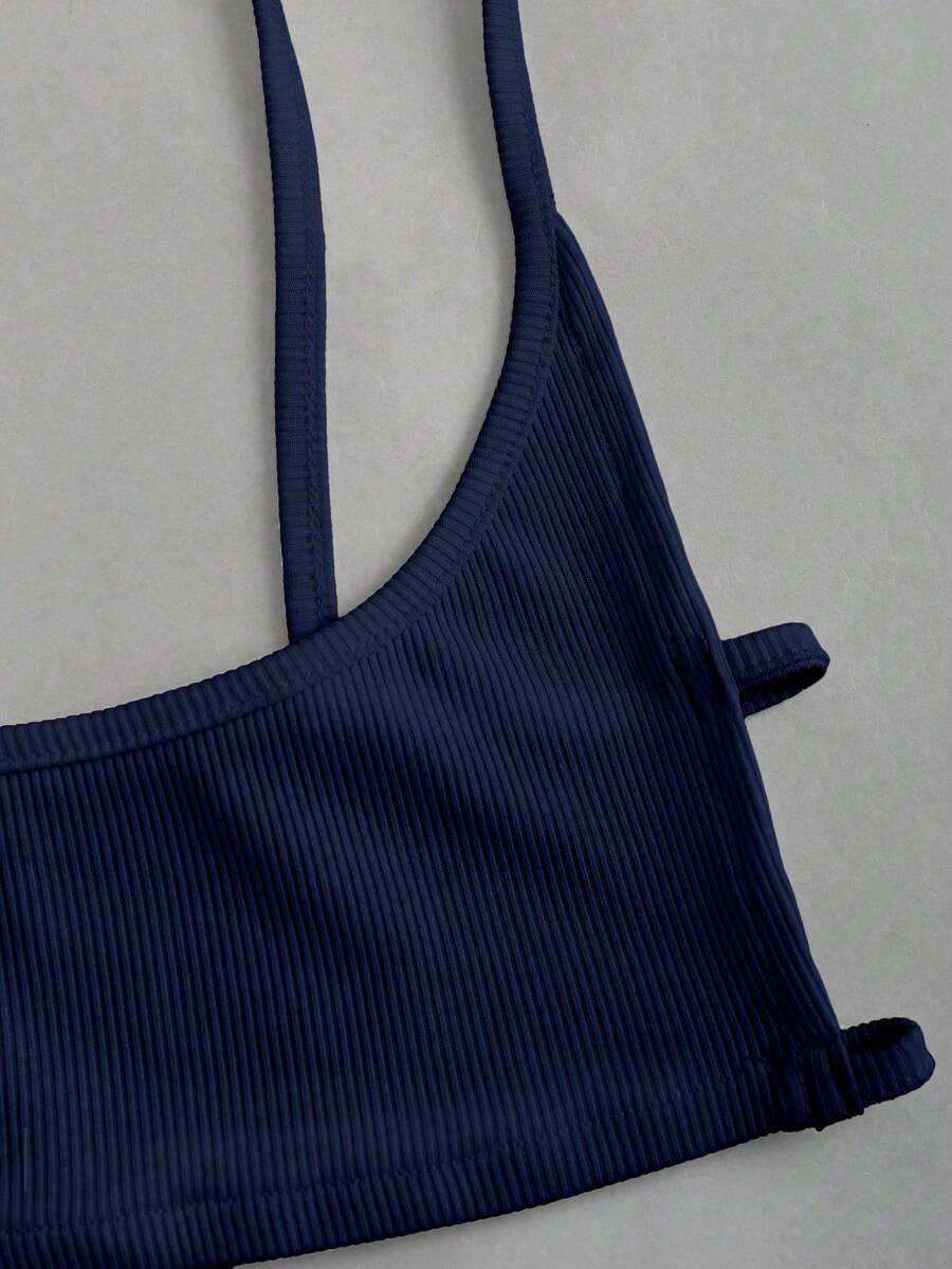 Women's black cropped camisole top with faux crocodile texture, backless spaghetti straps, and matching arm sleeves.