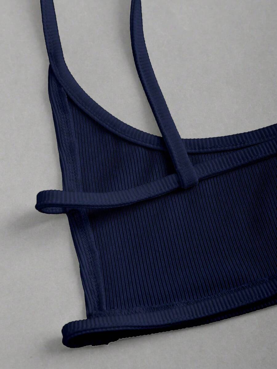 Women's black cropped camisole top with faux crocodile texture, backless spaghetti straps, and matching arm sleeves.