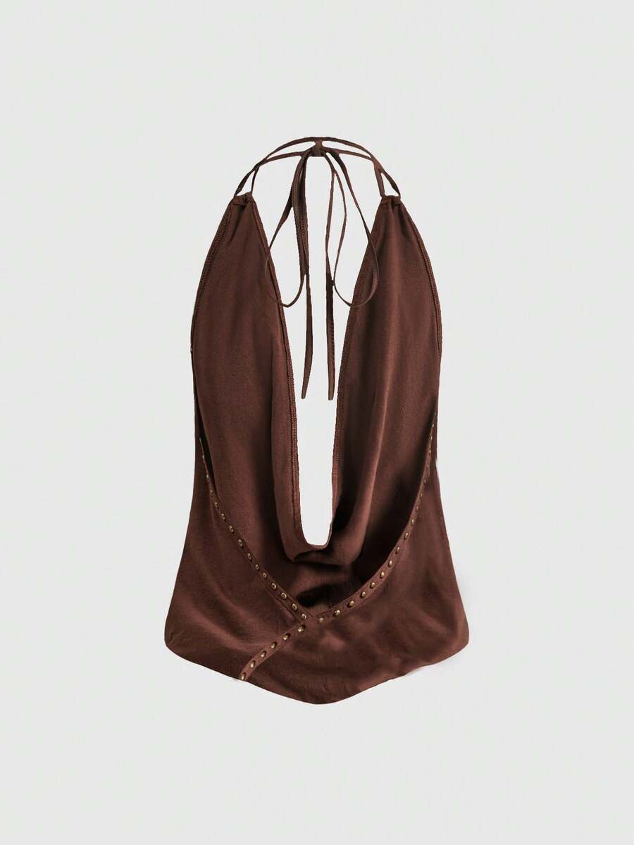 Women's black backless halter crop top featuring a V-neckline, tie-back detail, and asymmetrical hem.