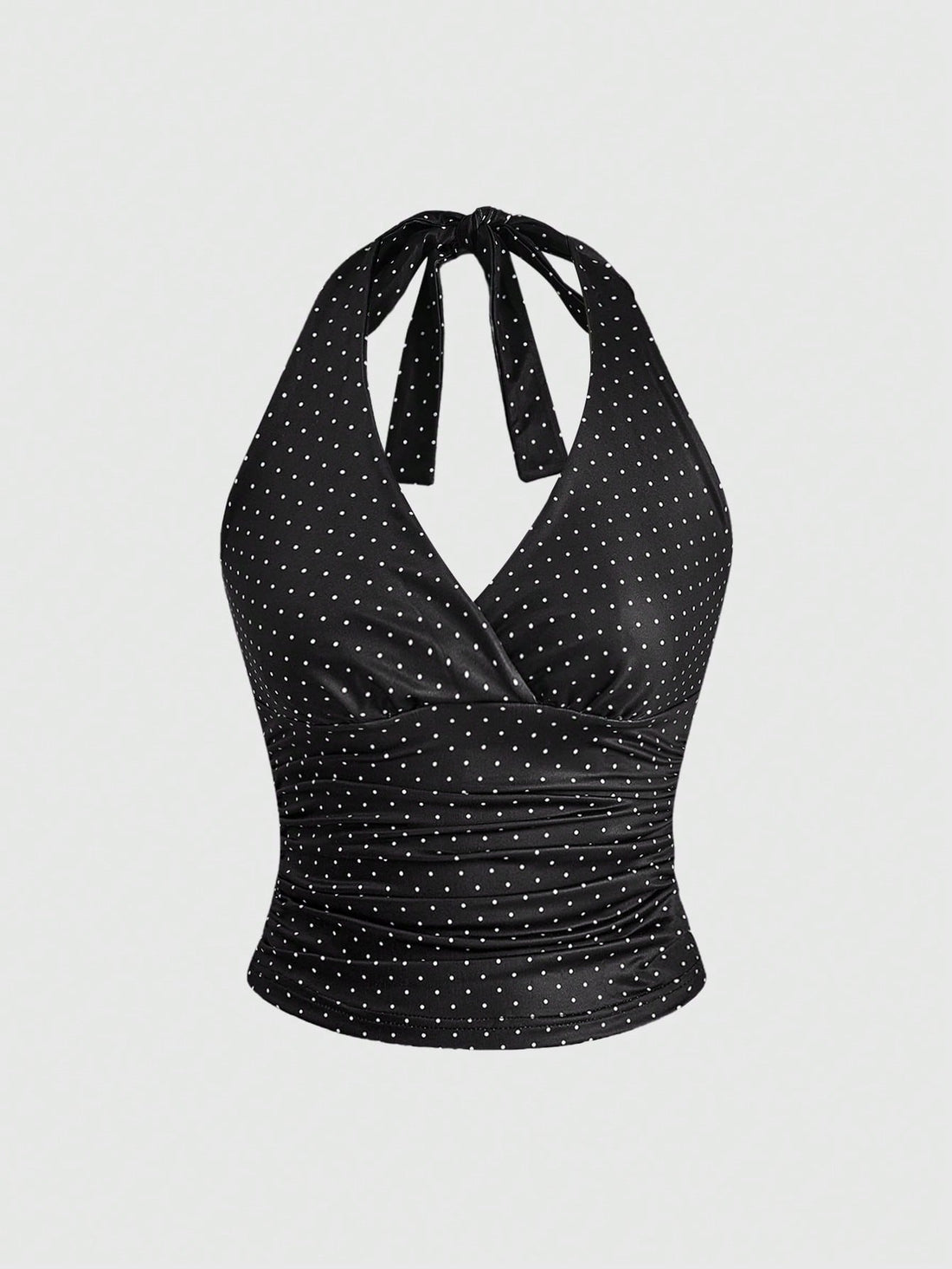 Women's halter crop tank top featuring a backless silhouette and ruched detailing in a slim fit design.