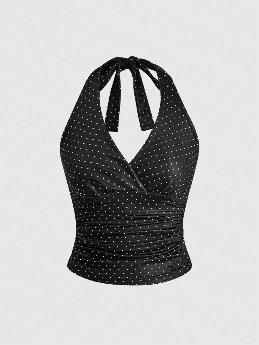 Women's halter crop tank top featuring a backless silhouette and ruched detailing in a slim fit design.