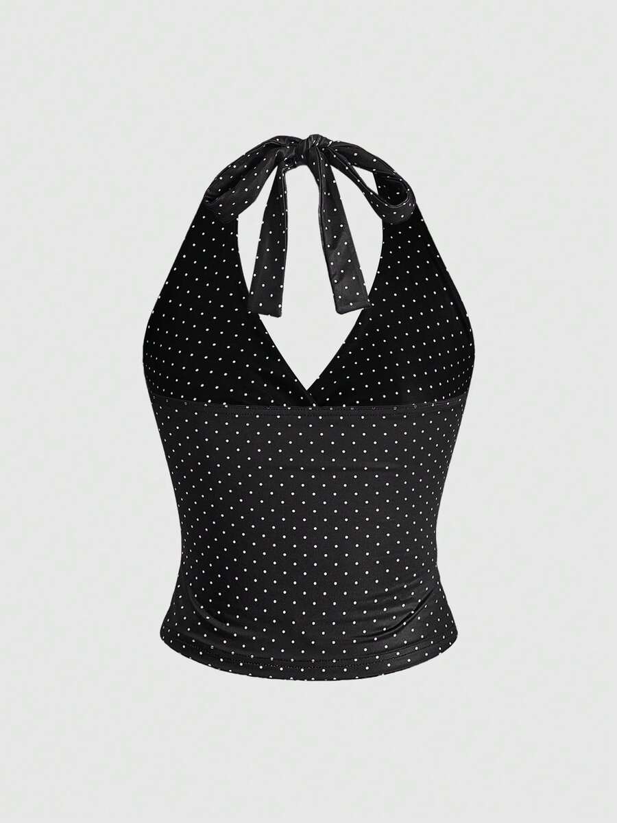 Women's halter crop tank top featuring a backless silhouette and ruched detailing in a slim fit design.