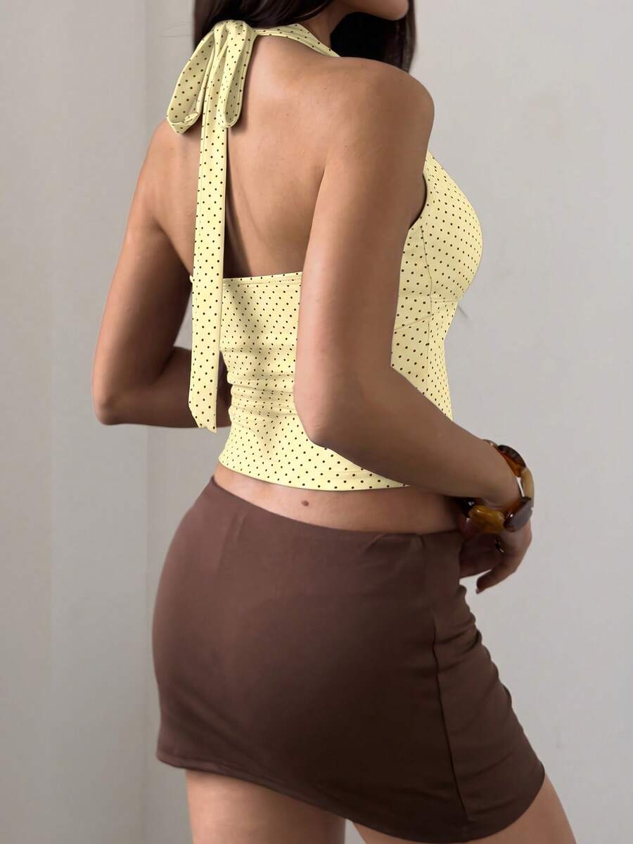 Women's sleeveless halter crop top featuring contrast lace trim and a slim fit design.