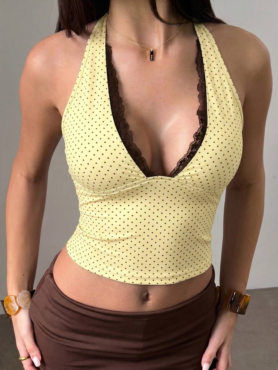 Women's sleeveless halter crop top featuring contrast lace trim and a slim fit design.