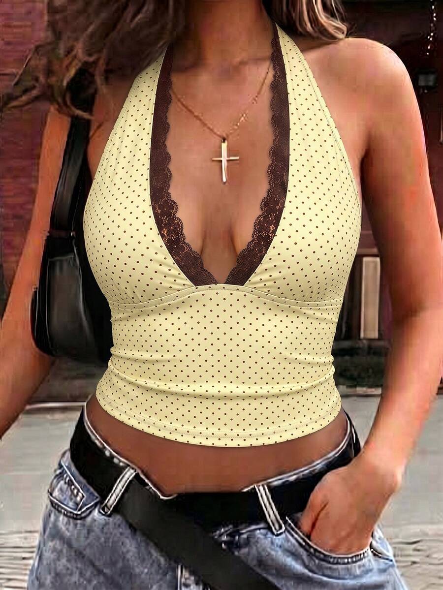 Women's sleeveless halter crop top featuring contrast lace trim and a slim fit design.