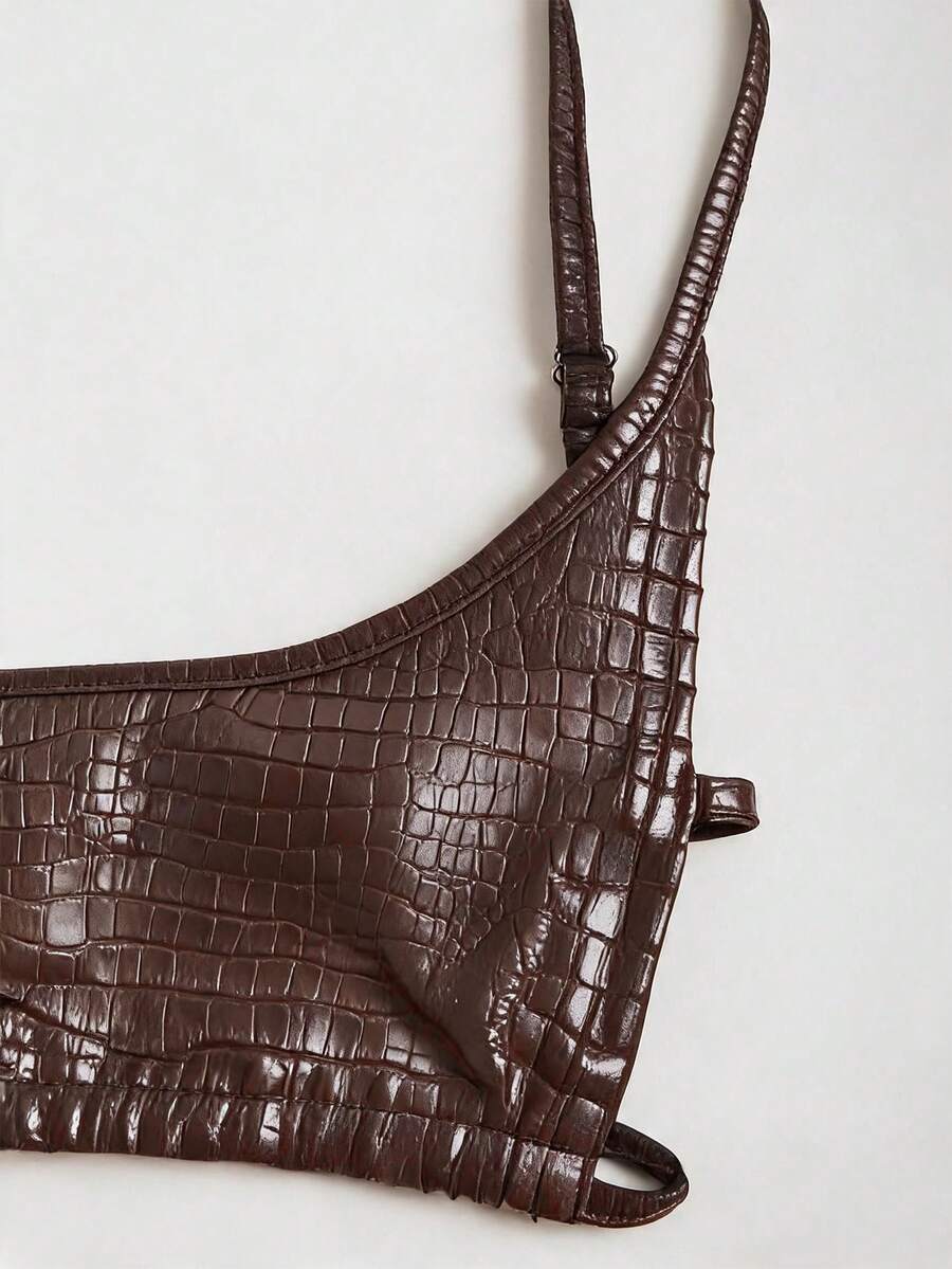 Women's black cropped camisole top with faux crocodile texture, backless spaghetti straps, and matching arm sleeves.