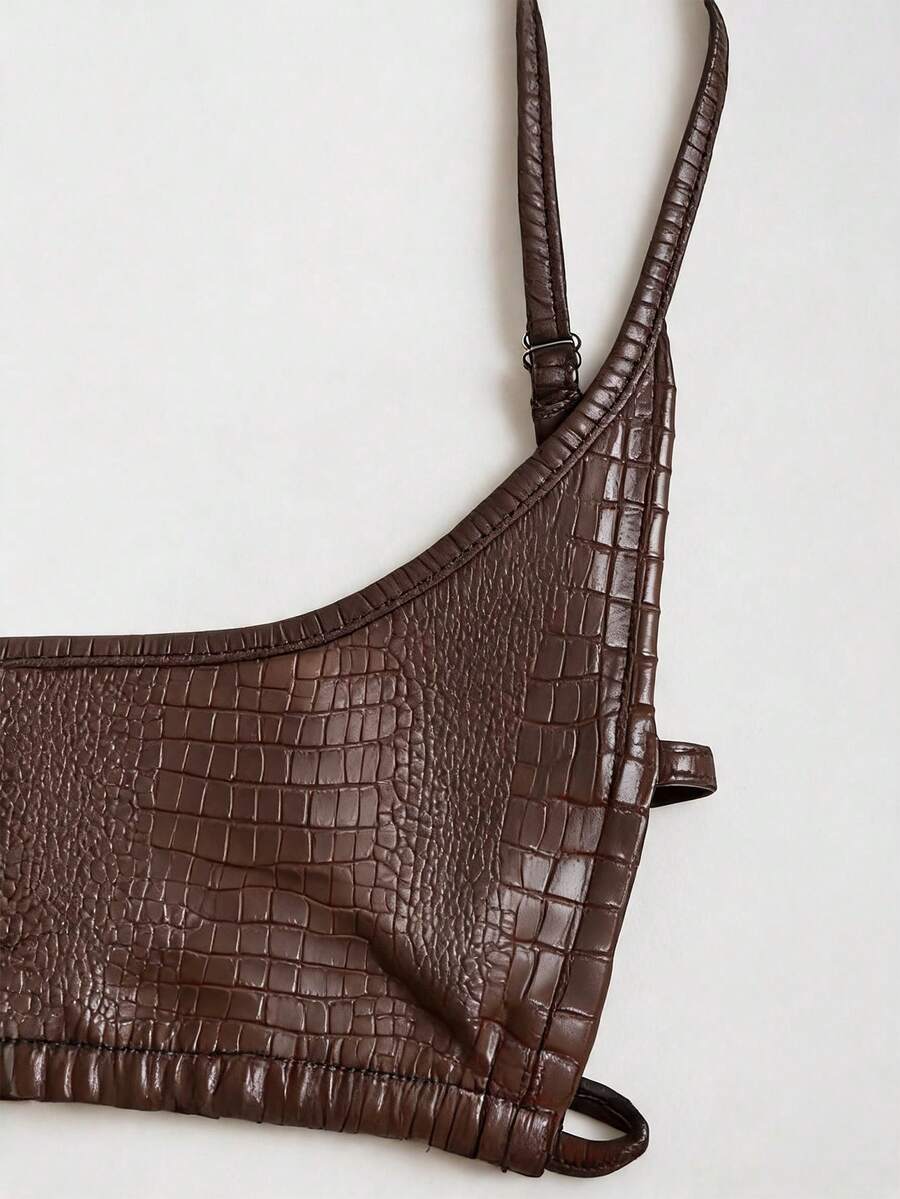 Women's black cropped camisole top with faux crocodile texture, backless spaghetti straps, and matching arm sleeves.